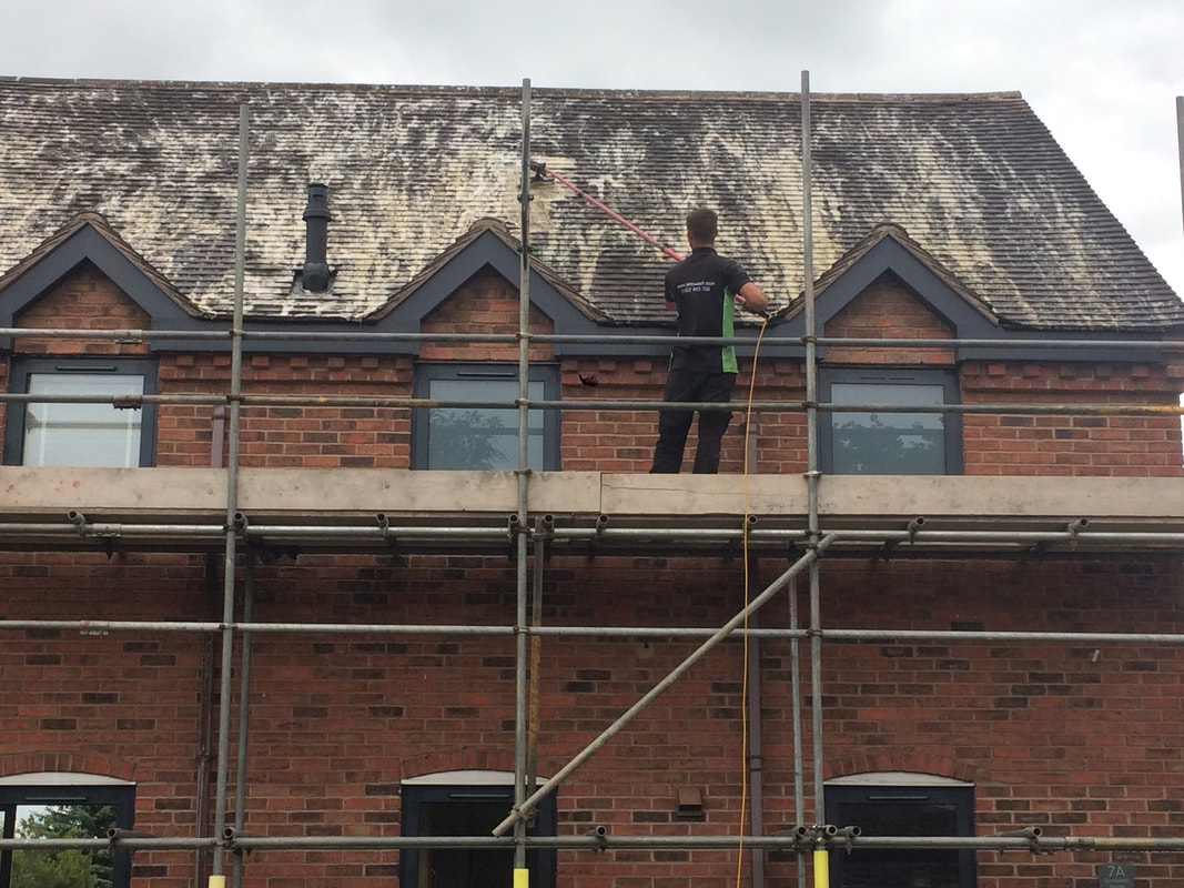 Softwashing a roof in Walsall